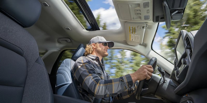 Driver behind the wheel of a Ford Bronco Sport