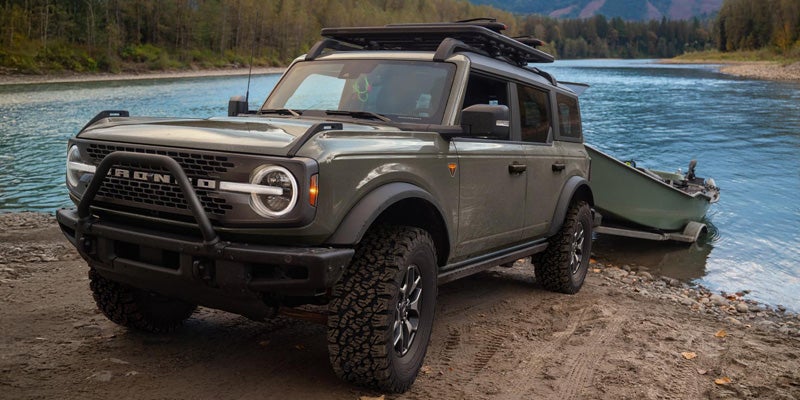 Ford Bronco beside a lake