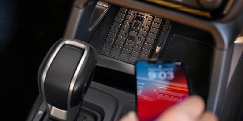 Phone resting on the available wireless charging pad in a 2026 Ford Ranger